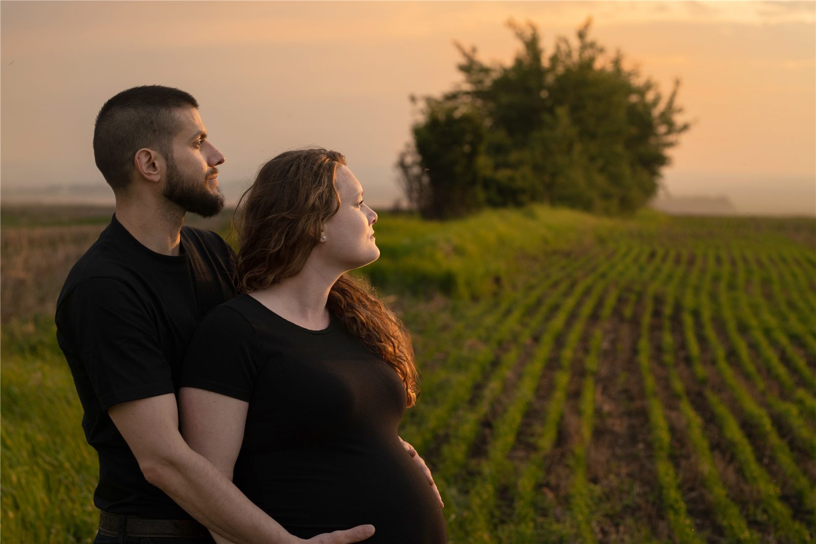 Alessio and Reanna Zilli at sunset over an Alberta field