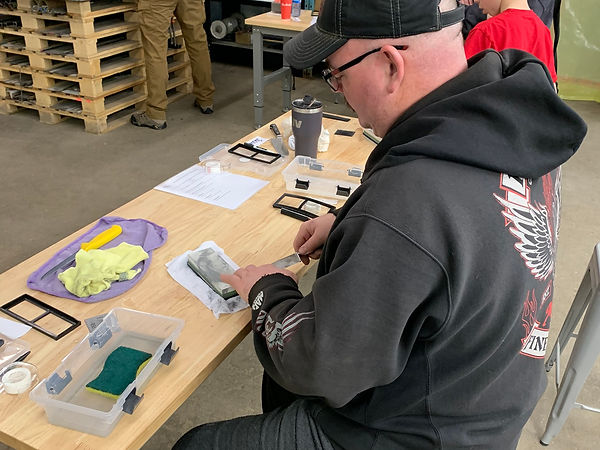 Students at the bench during a sharpening workshop