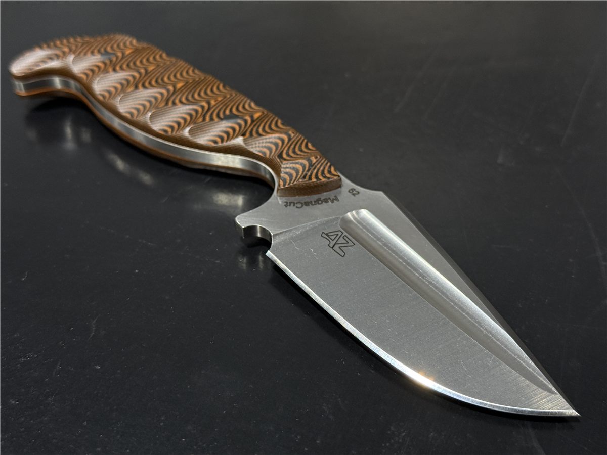 Defender in MagnaCut with orange and black scalloped G10