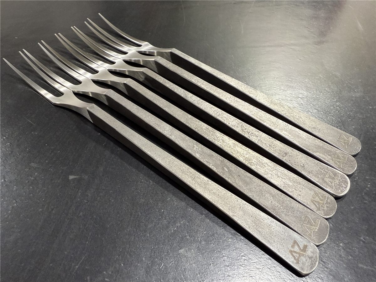 Set of hand-forged stainless steel table forks